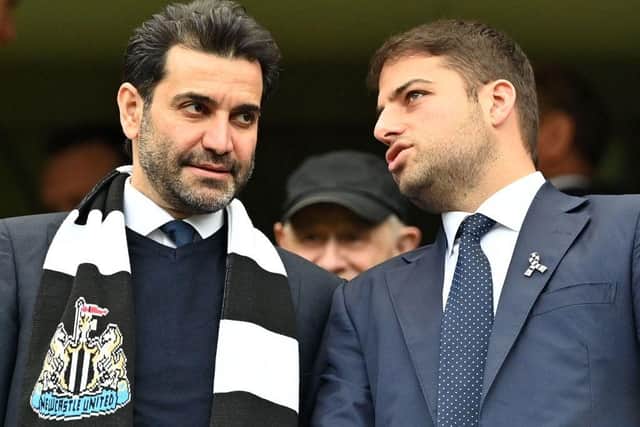 Newcastle United directors Mehrdad Ghodoussi (L) and Jamie Reuben react in the stands ahead of English Premier League football match between Chelsea and Newcastle United at Stamford Bridge in London on March 13, 2022. (Photo by JUSTIN TALLIS/AFP via Getty Images)