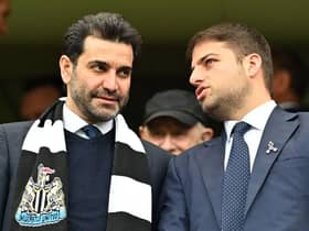 Newcastle United directors Mehrdad Ghodoussi (L) and Jamie Reuben react in the stands ahead of English Premier League football match between Chelsea and Newcastle United at Stamford Bridge in London on March 13, 2022. (Photo by JUSTIN TALLIS/AFP via Getty Images)