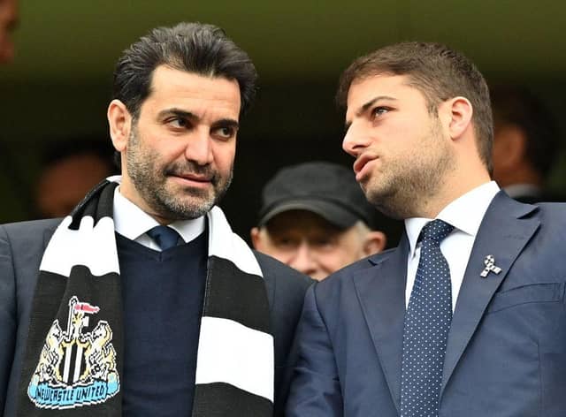 Newcastle United directors Mehrdad Ghodoussi (L) and Jamie Reuben react in the stands ahead of English Premier League football match between Chelsea and Newcastle United at Stamford Bridge in London on March 13, 2022. (Photo by JUSTIN TALLIS/AFP via Getty Images)