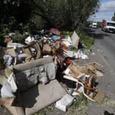 Fly-tipped rubbish and waste is seen beside a road in Colnbrook, near Heathrow, west of London on May 11 2020.