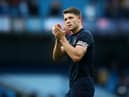 James Tarkowski of Burnley acknowledges the fans after his sides defeat in the Premier League match between Manchester City and Burnley at Etihad Stadium on October 16, 2021 in Manchester, England. (Photo by Jan Kruger/Getty Images)