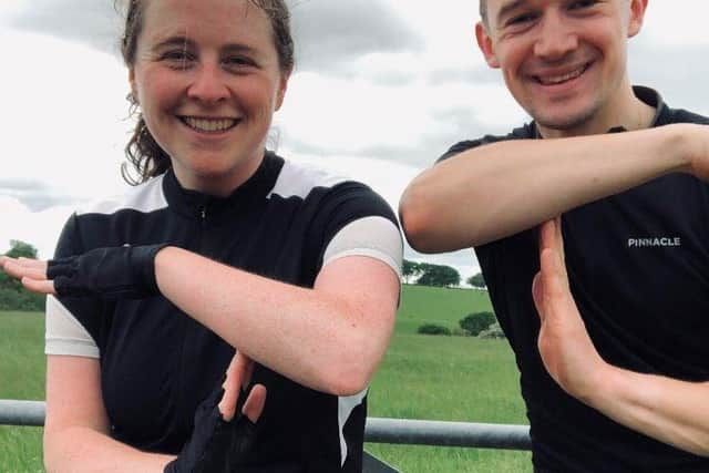 Sarah Pagan and Alex Hagan doing a T for Tom on one of their practice rides