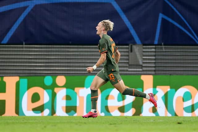 LEIPZIG, GERMANY - SEPTEMBER 06: Mykhaylo Mudryk of Shakhtar Donetsk celebrates after scoring their team's third goal during the UEFA Champions League group F match between RB Leipzig and Shakhtar Donetsk at Red Bull Arena on September 06, 2022 in Leipzig, Germany. (Photo by Cathrin Mueller/Getty Images)