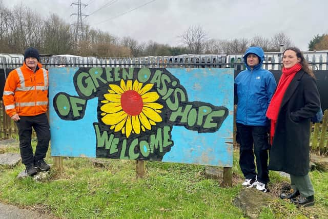 Amelia Noake, Yousef Rastgoo and Dave Johnson at the community garden.