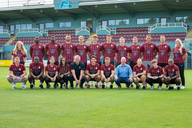 South Shields FC men and women line up in the new home strip. Pulman’s Ian Buckle, Managing Director (left) and Chris Slater, Commercial Director (right) join the squad.)