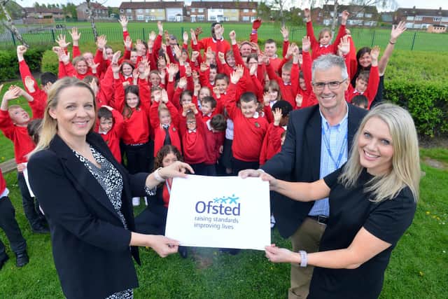 From left, head of school Emma Riches, chair of the governing board John Watson and executive head teacher Gemma Jeynes celebrate the Ofsted report with pupils from Hedworthfield Primary in Jarrow.