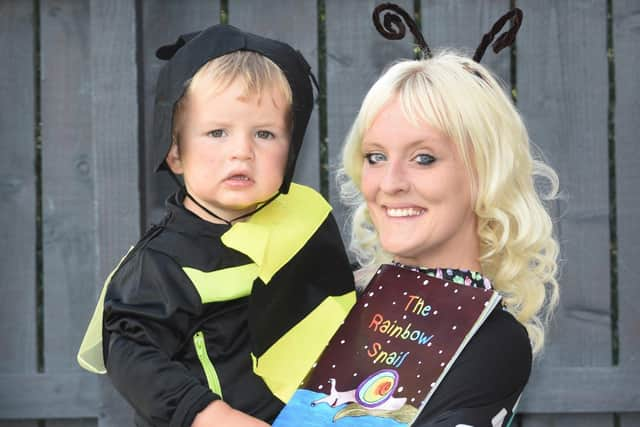 Mum Lauren Davis , son Jesse and the book she produced for him.