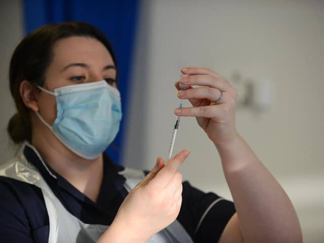 A vaccine being prepared for administration in the North East