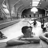 The 1993 photo which got the huge response. It shows Karl Peacock and Ian Gardener taking a rest as youngsters enjoy their last day at Derby Street  baths.