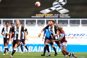 Aston Villa's Brazilian midfielder Douglas Luiz (R) vies for the ball against Newcastle United's English defender Jamaal Lascelles (2nd R) during the English Premier League football match between Newcastle United and Aston Villa at St James' Park in Newcastle-upon-Tyne, north east England on June 24, 2020.