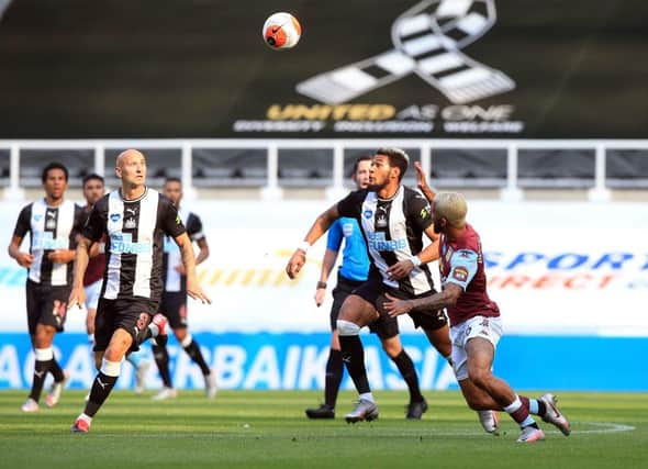 Aston Villa's Brazilian midfielder Douglas Luiz (R) vies for the ball against Newcastle United's English defender Jamaal Lascelles (2nd R) during the English Premier League football match between Newcastle United and Aston Villa at St James' Park in Newcastle-upon-Tyne, north east England on June 24, 2020.