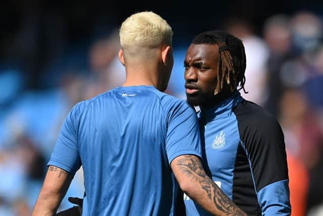 Bruno Guimaraes embraces Allan Saint-Maximin of Newcastle United (Photo by Stu Forster/Getty Images)