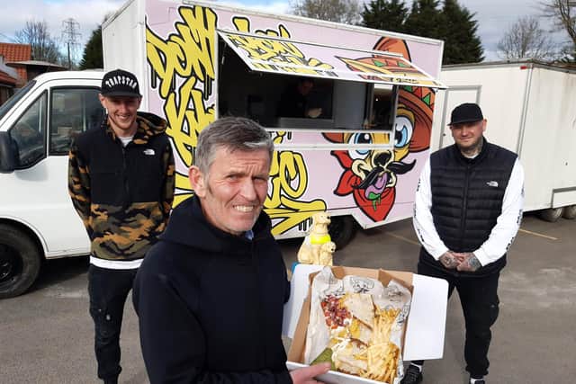 The Lakeside Inn manager Carl Mowatt with  takeaway food van 'Don't You Know I'm Loco' owners Gav Gates and Peter Steventon (R)