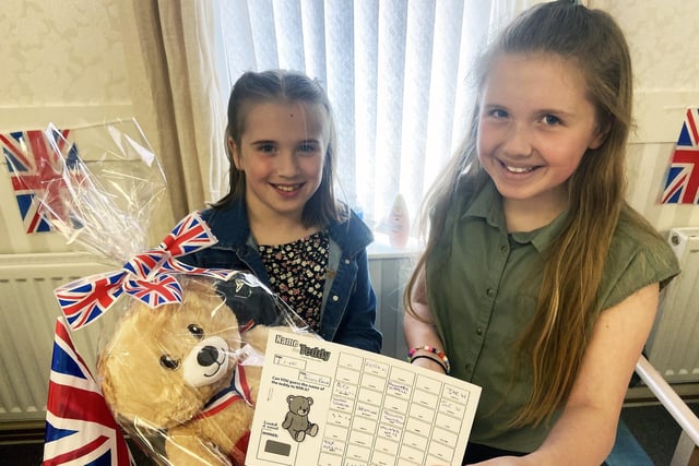 Jasmine, left, and Savanna Stokell who are running the 'Name the Teddy' competition during the celebrations at Jubilee Court.