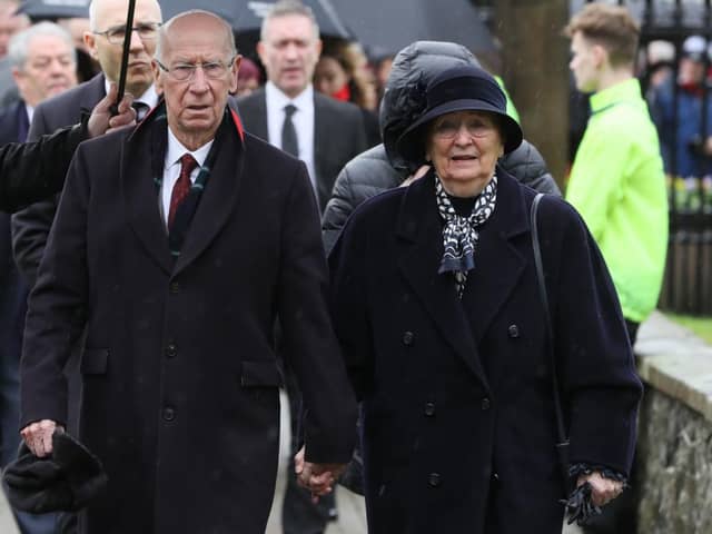 Sir Bobby Charlton and wife Lady Norma pictured in February this year as they attended the funeral of former Manchester United and Northern Ireland player Harry Gregg. Photo by Getty Images.