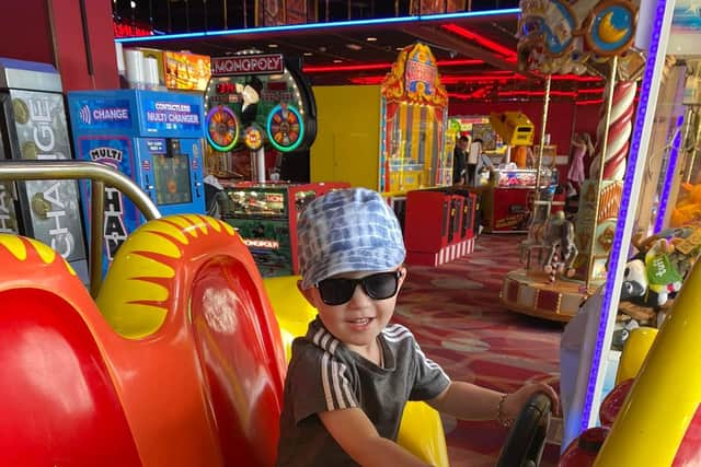 Elijah driving the car in the arcades