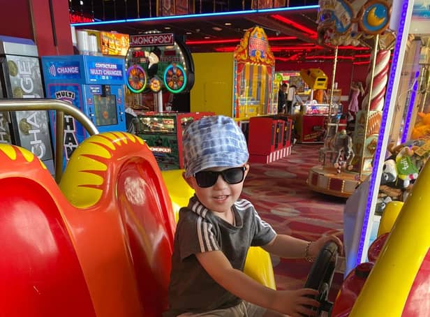 Elijah driving the car in the arcades