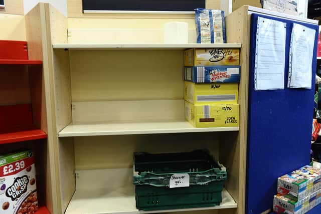 Empty shelves at the Key 2 Life food bank.