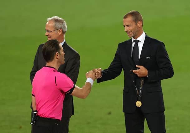 COLOGNE, GERMANY - AUGUST 21: Aleksander Ceferin, President of UEFA fist bumps with Match Referee, Danny Makkelie following the UEFA Europa League Final between Seville and FC Internazionale at RheinEnergieStadion on August 21, 2020 in Cologne, Germany. (Photo by Lars Baron/Getty Images)