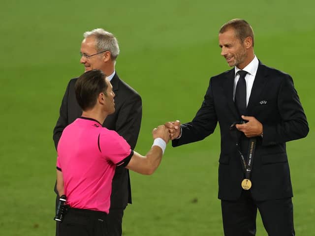COLOGNE, GERMANY - AUGUST 21: Aleksander Ceferin, President of UEFA fist bumps with Match Referee, Danny Makkelie following the UEFA Europa League Final between Seville and FC Internazionale at RheinEnergieStadion on August 21, 2020 in Cologne, Germany. (Photo by Lars Baron/Getty Images)