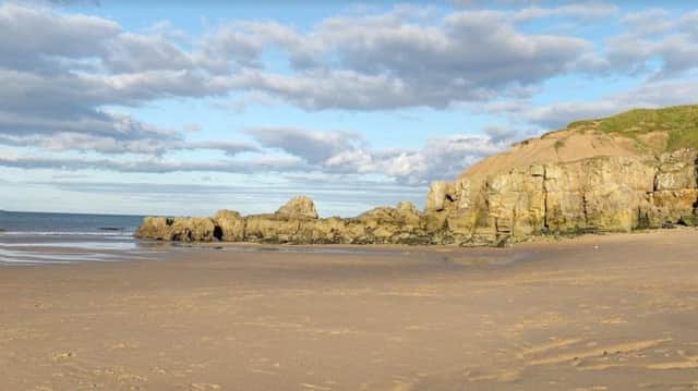 A woman was rescued after she slipped on the rocks near Trow Point.