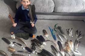 Dylan Barney with some of his feathers.