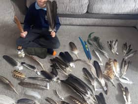 Dylan Barney with some of his feathers.