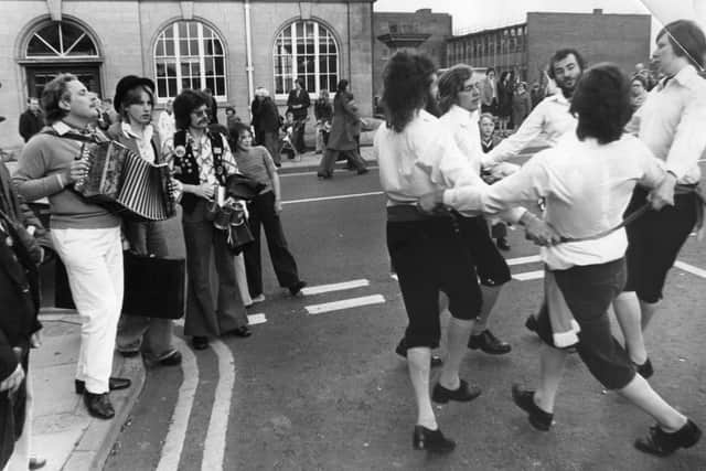 Hot work in the sun. A group of Morris dancers outside South Shields Town Hall before the start of the Sports Week carnival parade in June 1976.
