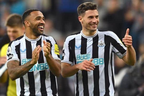 Callum Wilson (c) and Fabian Schar of Newcastle United share a joke as they applaud the fans after the Premier League match between Newcastle United and Everton FC at St. James Park on October 19, 2022 in Newcastle upon Tyne, England. (Photo by Stu Forster/Getty Images)