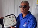 The Red Hackle pub owner Lee Hughes with the AEDs public access defibrillators.