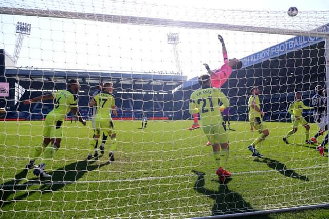 Martin Dubravka of Newcastle United tips a shot over the bar during the Premier League match between West Bromwich Albion and Newcastle United at The Hawthorns on March 07, 2021 in West Bromwich, England. Sporting stadiums around the UK remain under strict restrictions due to the Coronavirus Pandemic as Government social distancing laws prohibit fans inside venues resulting in games being played behind closed doors. (Photo by Gareth Copley/Getty Images)