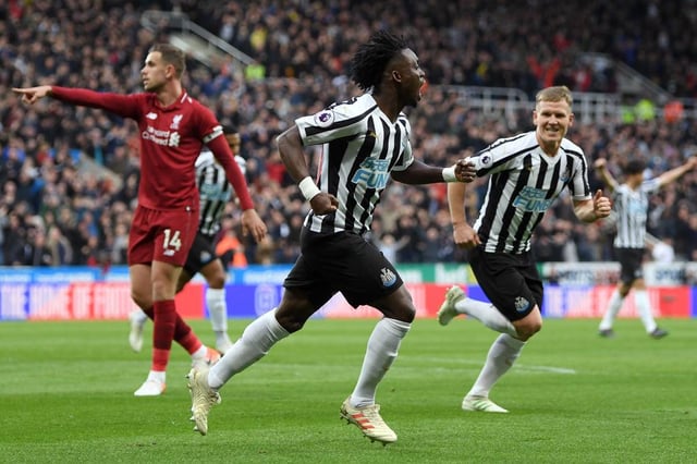 Christian Atsu of Newcastle United celebrates after scoring his team's first goal during the Premier League match between Newcastle United and Liverpool FC at St. James Park on May 04, 2019 in Newcastle upon Tyne, United Kingdom.