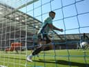 Kieran Trippier of Newcastle United clears the shot of Solly March of Brighton & Hove Albion (Not seen) of the line during the Premier League match between Brighton & Hove Albion and Newcastle United at American Express Community Stadium on August 13, 2022 in Brighton, England. (Photo by Steve Bardens/Getty Images)