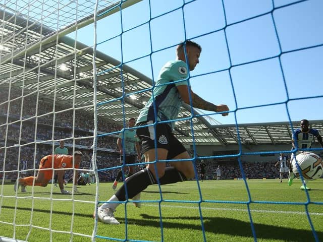 Kieran Trippier of Newcastle United clears the shot of Solly March of Brighton & Hove Albion (Not seen) of the line during the Premier League match between Brighton & Hove Albion and Newcastle United at American Express Community Stadium on August 13, 2022 in Brighton, England. (Photo by Steve Bardens/Getty Images)