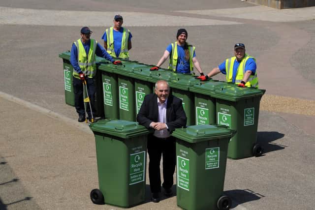 South Tyneside Council Cllr Ernest Gibson, with season beach workers, John Hunter, Rya MacAtee, Ian Winter and Danny George, with new waste recycling bins along the walkway, Sandhaven Beach, South Shields.