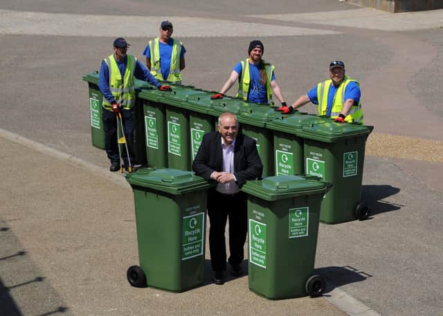 South Tyneside Council Cllr Ernest Gibson, with season beach workers, John Hunter, Rya MacAtee, Ian Winter and Danny George, with new waste recycling bins along the walkway, Sandhaven Beach, South Shields.