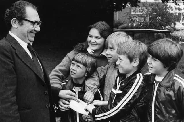 Michael and John McKone, Neil and Ian Stelling with Tracy James presenting a cheque to Joe Kersh, organiser of the South Tyneside Scanner Appeal. Money was raised by a jumble sale in 1978.