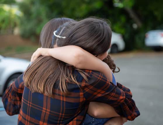 Hugging could return by May, so long as conditions allow