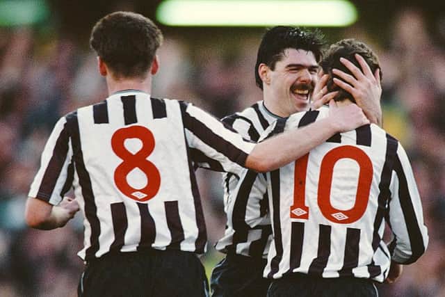 Micky Quinn (c) and Kevin Dillon celebrate with goalscorer Mark McGhee during the FA Cup 5th round match between Newcastle United and Manchester United at St James' Park on February 18, 1990 in Newcastle, England.  (Photo by Rusty Cheyne/Allsport/Getty Images)