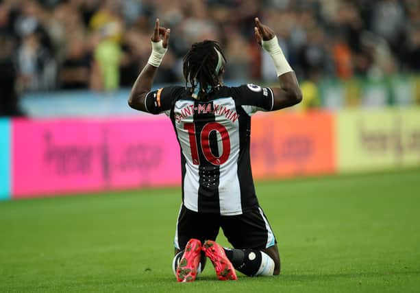 NEWCASTLE UPON TYNE, ENGLAND - SEPTEMBER 17: Allan Saint-Maximin of Newcastle United  celebrates after scoring their team's first goal  during the Premier League match between Newcastle United and Leeds United at St. James Park on September 17, 2021 in Newcastle upon Tyne, England. (Photo by Ian MacNicol/Getty Images)