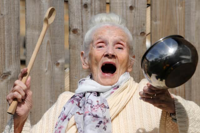 Retired nurse Winnie, 98, shows her support to the NHS during the Covid-19 pandemic.