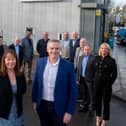 Paul Smith and Wendy Duffy with the new employee shareholders at HLA Group.