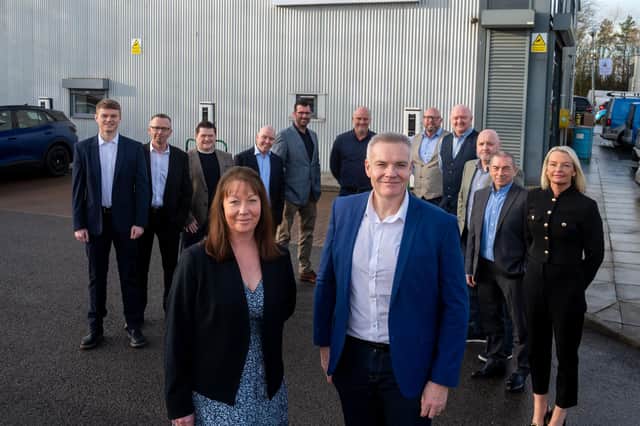 Paul Smith and Wendy Duffy with the new employee shareholders at HLA Group.