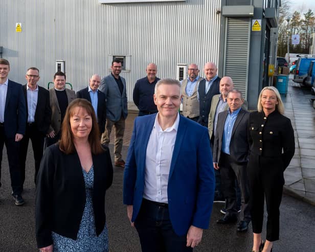 Paul Smith and Wendy Duffy with the new employee shareholders at HLA Group.