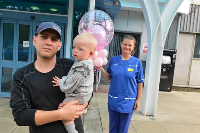 Dad Jack Bickley with daughter Mia who was the first baby born at South Tyneside Midwifery-Led Birthing Centre as the centre celebrates the first anniversary with midwife Michelle Becke