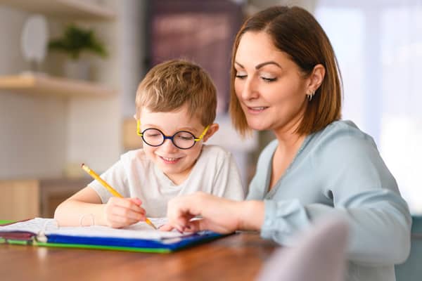 Practising some school work can prepare a child for the new term. Photo posed by models