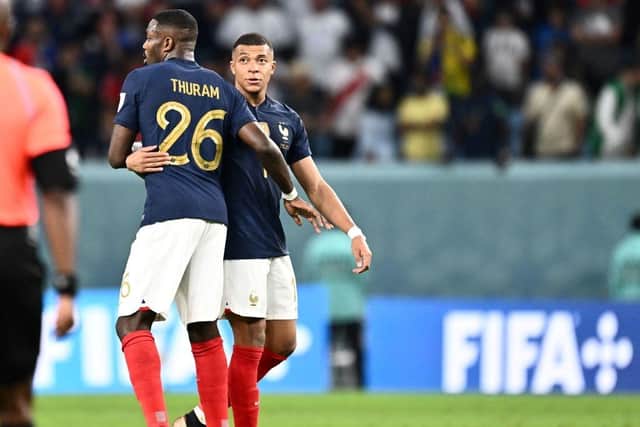 France's forward #10 Kylian Mbappe (R) and France's forward #26 Marcus Thuram celebrate at the end of the Qatar 2022 World Cup Group D football match between France and Australia at the Al-Janoub Stadium in Al-Wakrah, south of Doha on November 22, 2022. (Photo by Jewel SAMAD / AFP) (Photo by JEWEL SAMAD/AFP via Getty Images)