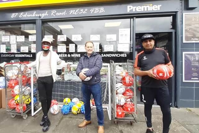 Former Sunderland player Pascal Chimbonda (left) with BBC Sports presenter Jeff Brown and Premier shop owner Nico Ali.