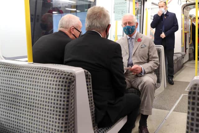 King Charles III, then Prince of Wales, taking a ride on the Metro.