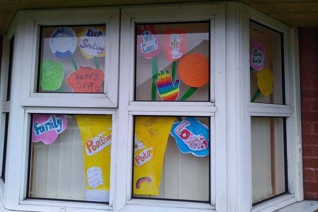 Create window art;
Fiona said: "Colourful window displays are a great way of getting creative and bringing smiles to your neighbours faces. One of our group members created this lovely display of “Positive Pots” of paper flowers with messages of hope and creativity.